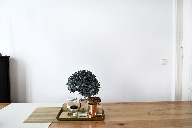 craft workshop desk with bead trays cord spools and finished bracelets in a bright modern setting